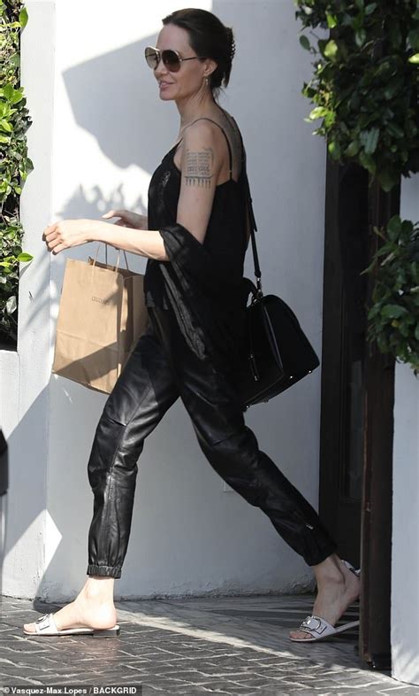 Angelina Jolie Looks Every Inch The Movie Star In Black Tank Top And
