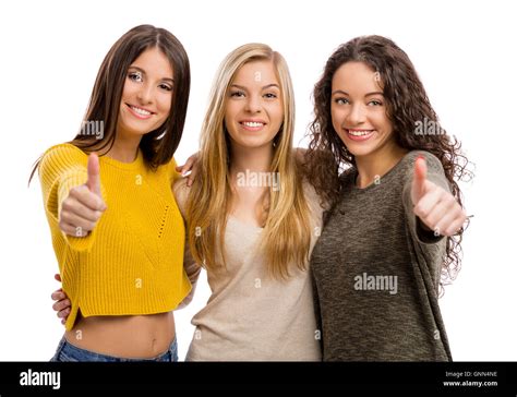 Studio Portrait Of Three Teenage Girls With Thumbs Up Stock Photo Alamy