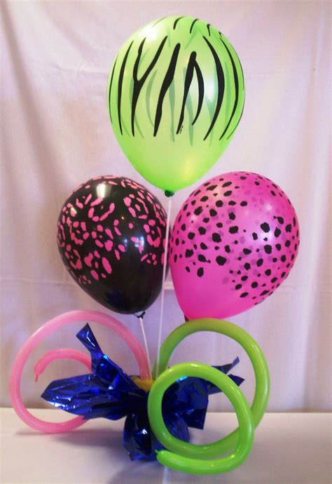 Some Balloons Are In The Shape Of Rings And Zebra Print On Them As