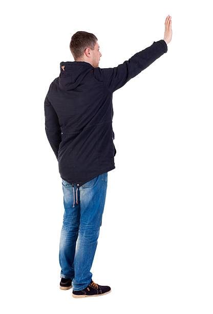 250 Rear View Of A Man Waving His Hand Stock Photos Pictures