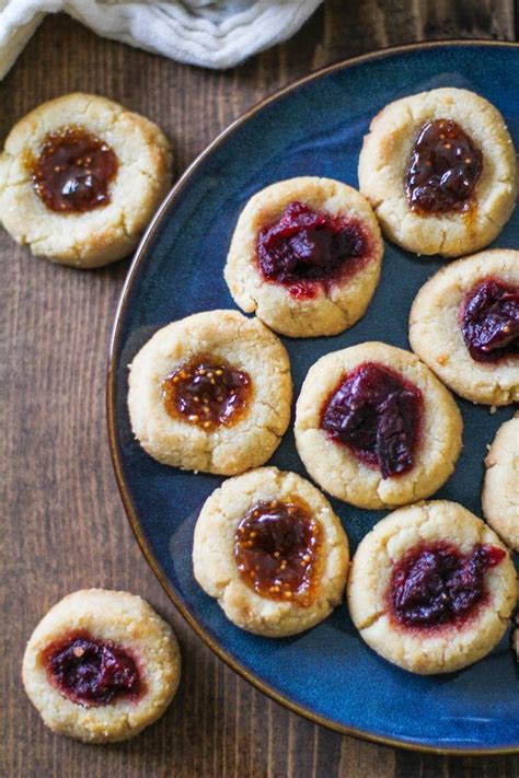 Baking powder helps them rise. Cardamom Almond Flour Paleo Thumbprint Cookies | TheRoastedRoot.net #… | Gluten free christmas ...