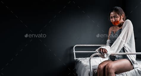 Asian Woman Victim Gagged On Bed Confined In Dark Room Stock Photo By Thanmano