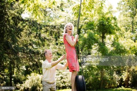 Adult Couple Outdoor Swing Tree Photos Et Images De Collection Getty