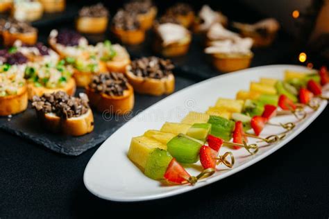 Catering Food Canapes With Fruits And Berries On Skewers Stock Image