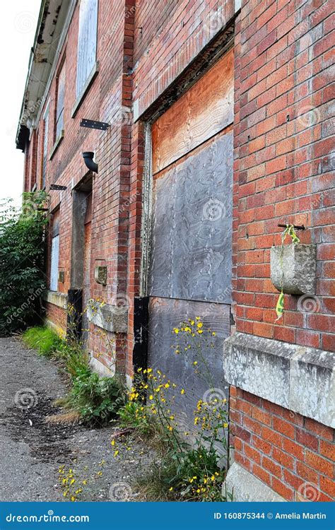 A Side View Of A Boarded Up Brick Building Stock Photo Image Of Rust
