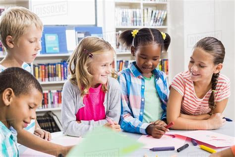 Kids Interacting With Each Other In Library At School