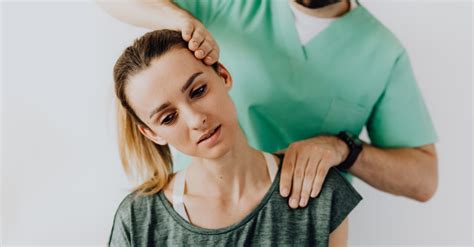 Professional Massage Therapist Releasing Tension In Female Patients