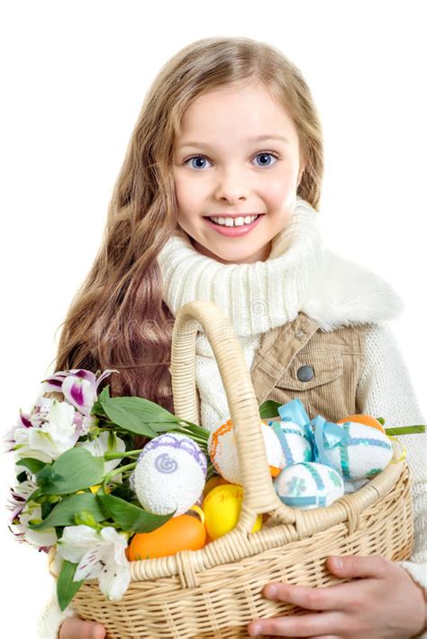 Smiling Little Girl With Basket Full Of Colorful Easter Eggs Stock