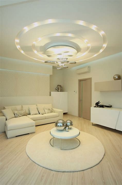In the centre of the ceiling, a recession is created to hold the two small fans, which almost seem to blend with the rest of the layout. POP false ceiling designs for living room 2015 | Ceiling ...