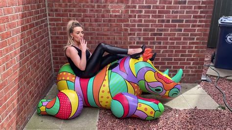 Inflatable Rhino Smoking Cigarette And High Heel Popping Youtube