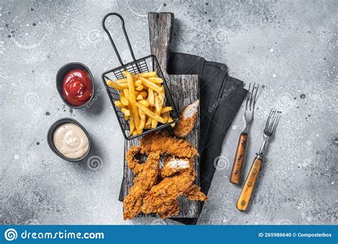 Breaded Chicken Strips With French Fries And Ketchup Gray Backgrund