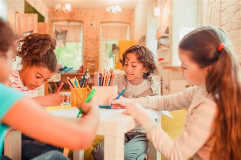 Group Of Children Drawing With Color Pencils Stock Photo Image Of