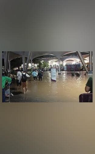 Ahmedabad Airport Flooded After Heavy Rain Passengers Walk Through