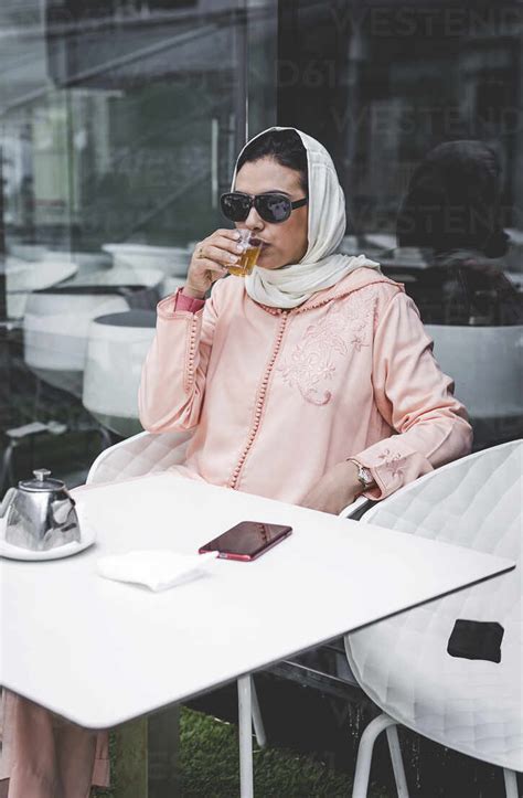 Nice Moroccan Woman With Hijab And Typical Arabic Dressdrinking Tea