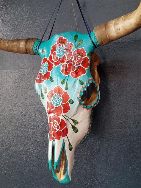 A Cow Skull With Flowers Painted On It