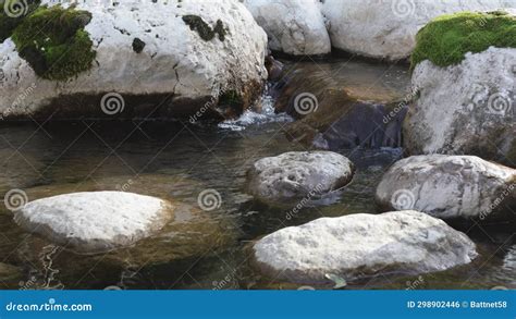 A Shallow Riverbed With A Rocky Bottom Shoals And A Small Stream Of
