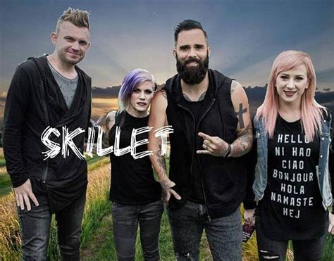 A Group Of People Standing Next To Each Other In Front Of A Sky With The Words Skilllift On It