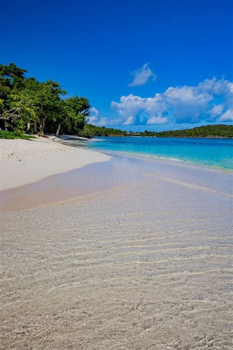 Crystal Clear Water Laps The White Sand Of Hawksnest Bay Beach Stock