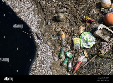 Plastic Waste Polluting Into Nature Rubbish And Bottles Floating On