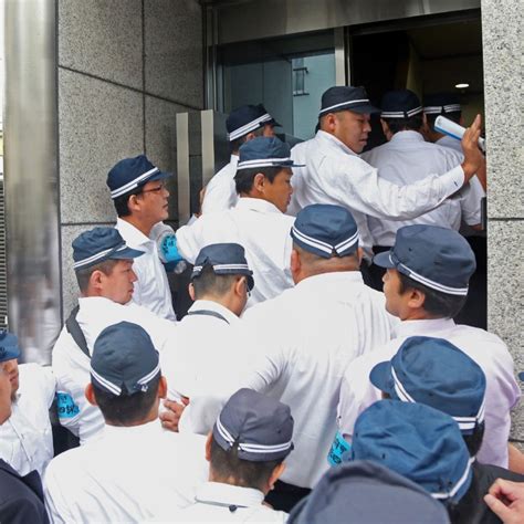 Japanese Police Raid Yakuza Offices As Split Raises Fears Of Gang