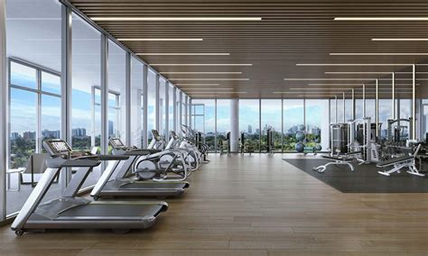 Light Filled Fitness Center With State Of The Art Fitness Equipment Gym Design Interior Home