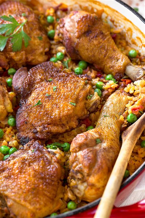 While the rice and chicken are constants, the ingredients and preparation styles can vary from country to country and region to region. Arroz con Pollo | The Cozy Apron
