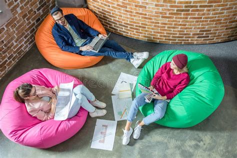 People In Bean Bag Chairs Stock Image Image Of Four 88567883