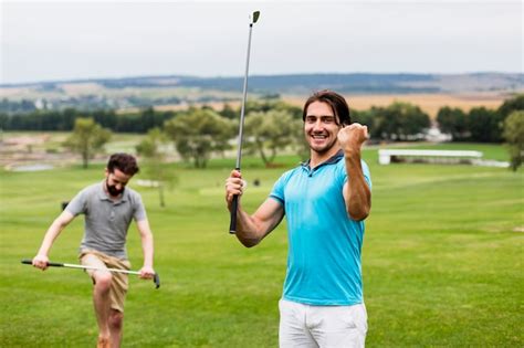 Free Photo Two Men Having Fun On Golf Course