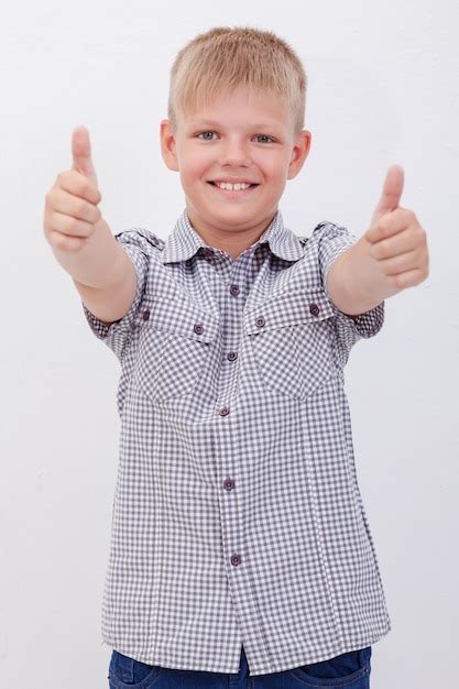 Free Photo Portrait Of Happy Boy Showing Thumbs Up Gesture