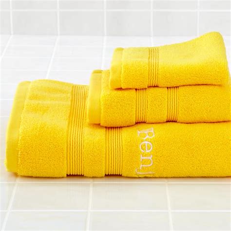 To accent your bathroom interior, see our selection of beautiful bath mats and bath rugs, made from the finest cotton and utterly soft to the touch. yellow-bath-towels Images - Frompo - 1