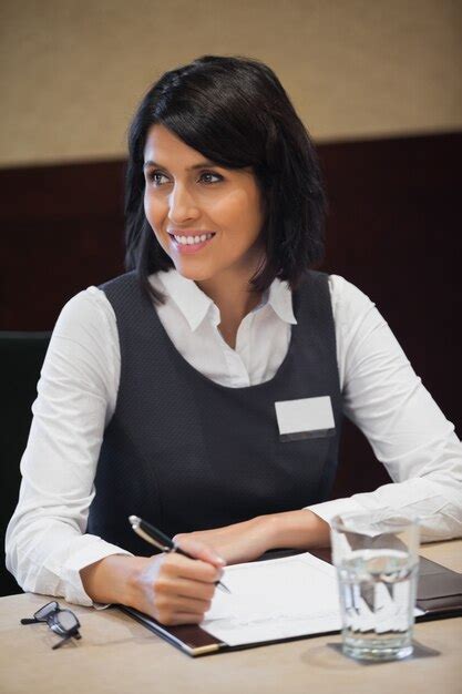 Premium Photo Smiling Businesswoman Taking Notes