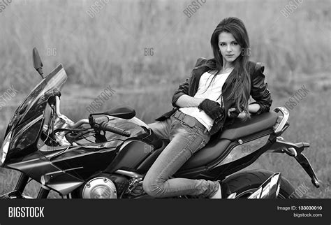 Biker Girl In A Leather Clothes On A Motorcycle Stock Photo By