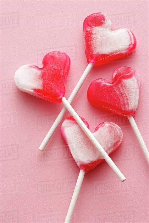 Four Heart Shaped Lollipops Stock Photo Dissolve