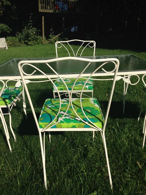 This dining set includes a table and six chairs based on welded cast aluminum frames. Vintage Outdoor Table Set Glass White Wrought Iron Table ...