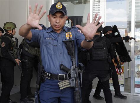 Philippines Philippine Police Officer Tries To Hold Off Eager Bystander And Journalist While