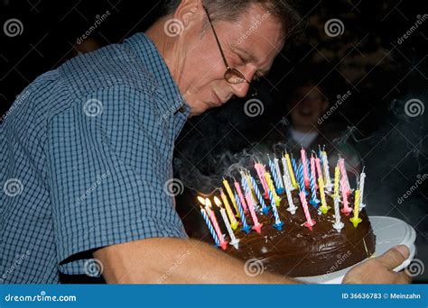 Man Blows Out His Birthday Candles Stock Image Image Of Person Anniversary