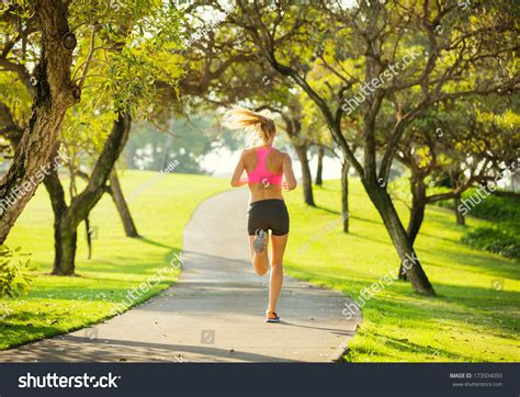 Athletic Fit Young Woman Jogging Running Outdoors Early