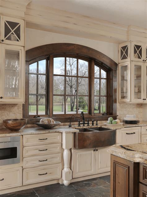 A range hood from brass is a perfect example. Old World-Inspired Kitchen | Beck/Allen Cabinetry