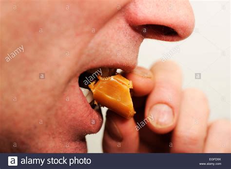 Male Eating Toffee Sweets Stock Photo Alamy