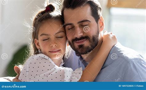 Young Dad And Little Daughter Hug Sharing Tender Moment Stock Image