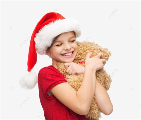 فتاة ترتدي قبعة بابا نويل المساعدة وهي تحمل بسعادة دب مرح عيد الميلاد Png صورة للتحميل مجانا
