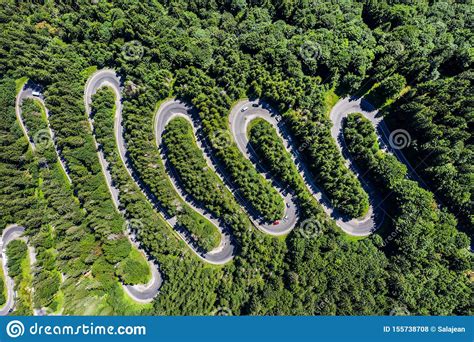 Aerial Top View Of A Winding Road In Green Forest Stock Photo Image