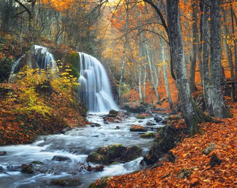 Waterfall At Mountain River In Autumn Forest At Sunset Stock Photo