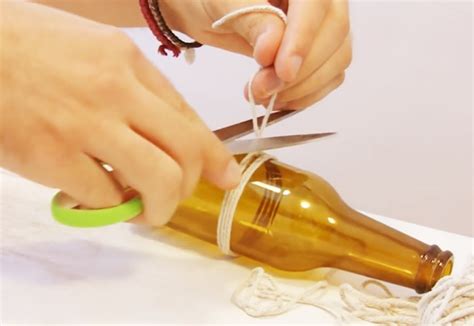 After the bottle has heated up an ice cube is rubbed around the score line. 3 Ways to Cut Glass Bottles