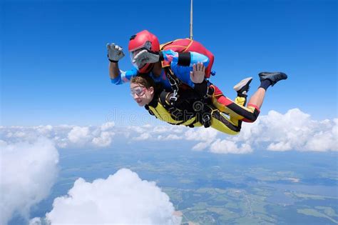 Skydiving Tandem Jump Two Skydivers Are In The Sky Stock Image