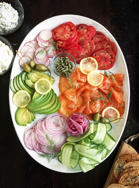 Toast the bagels and rye bread and serve up, for people to mix and match toppings as they wish. smoked salmon platter presentation | Smoked salmon platter ...