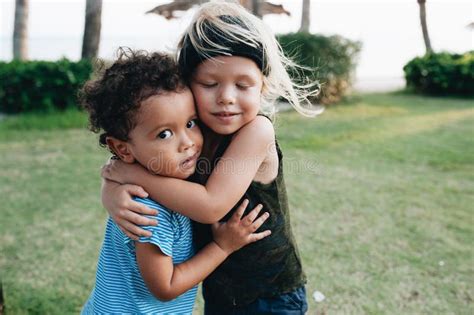 Two Happy Little Boys Hug Each Other Stock Photo Image Of Palm
