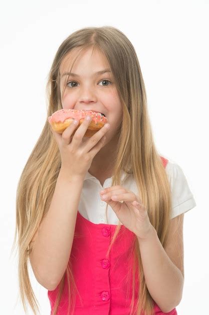 Premium Photo Small Girl Eating Dessert Happy Small Girl Enjoys Sweet