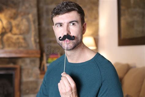 Cute Guy Holding A Fake Vintage Style Mustache Stock Photo Image Of