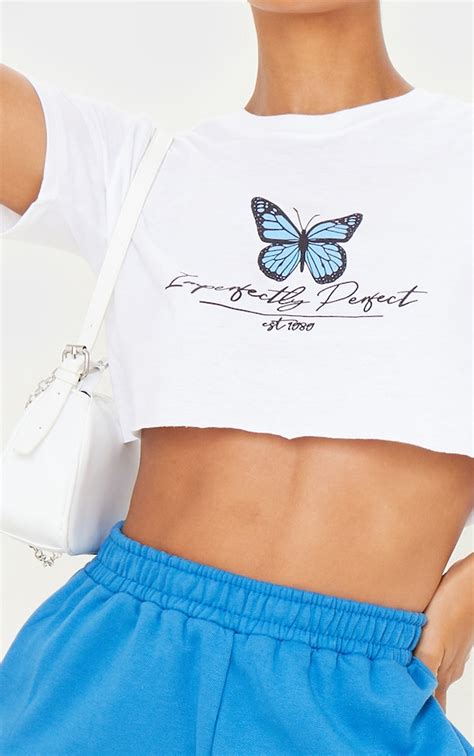 white imperfectly perfect butterfly crop t shirt prettylittlething